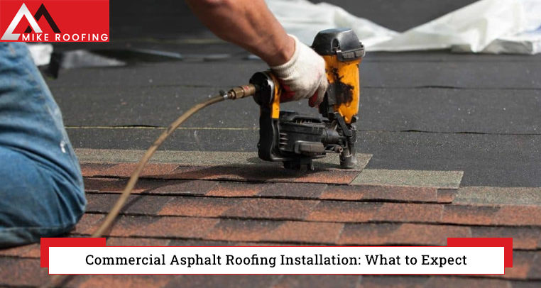 Workers installing a commercial asphalt roof