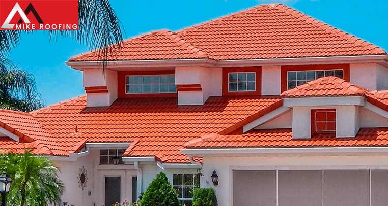 A stunning house featuring beautiful clay roof tiles.